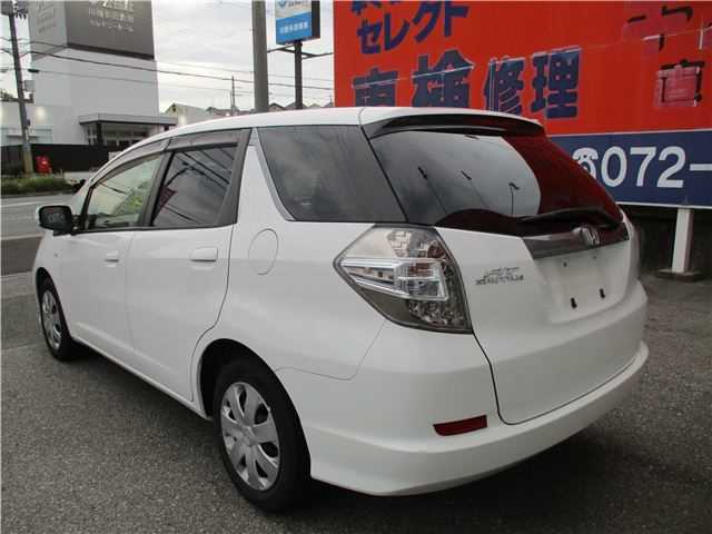 Is the HONDA FIT SHUTTLE 2013 fuel-efficient for Ugandan roads?