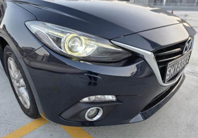 Is the MAZDA MAZDA3 SEDAN 2015 fuel-efficient for city driving in Uganda?